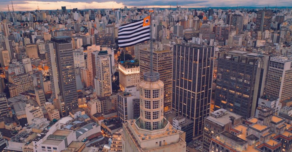 cityscape-of-contemporary-megapolis-with-flag-in-city-center-and-skyscrapers-located-around