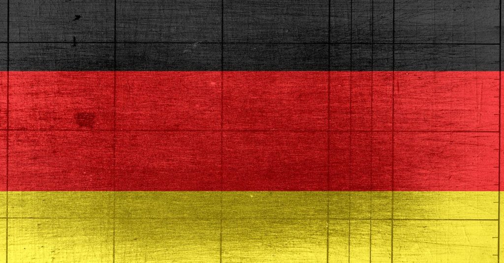 grungy-background-designed-as-flag-of-germany-on-shabby-wooden-board-with-measure-scale-2