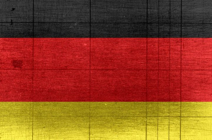 grungy-background-designed-as-flag-of-germany-on-shabby-wooden-board-with-measure-scale