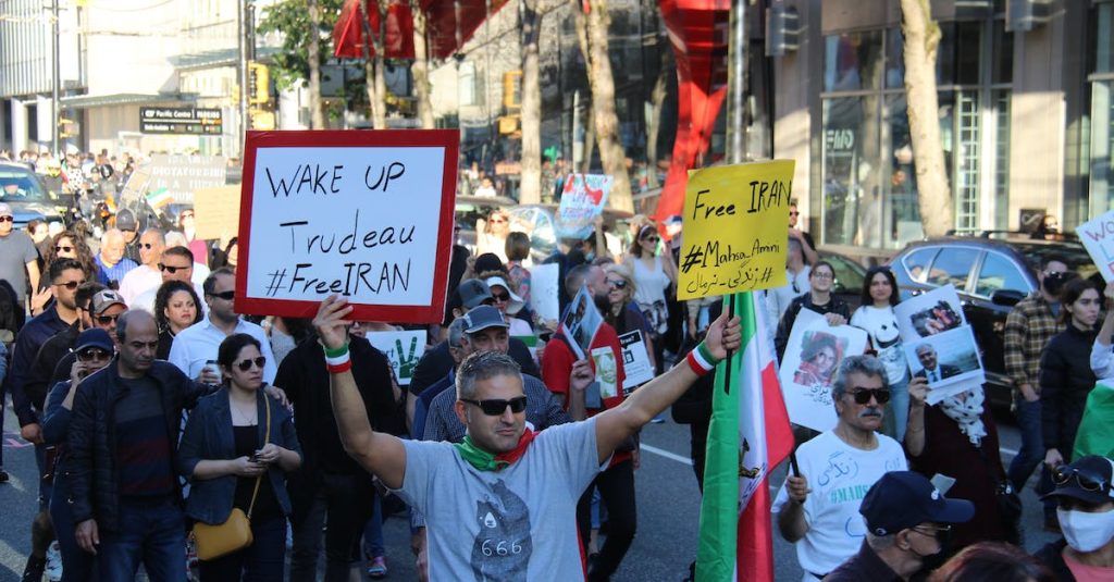 protesters-walking-on-street-holding-placards