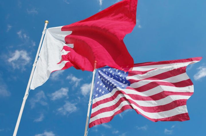 red-and-white-flag-under-blue-sky