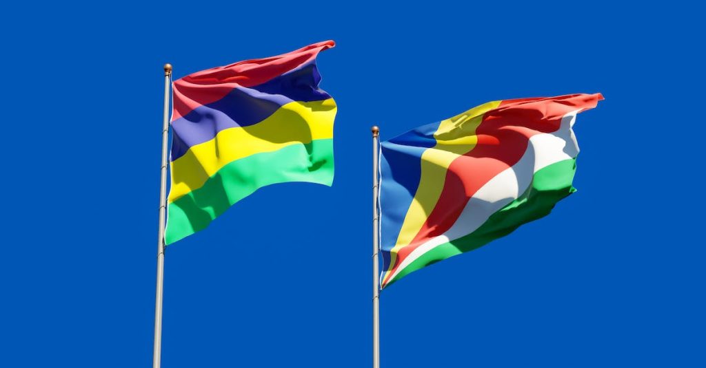 seychelles-and-mauritius-flags-under-the-blue-sky