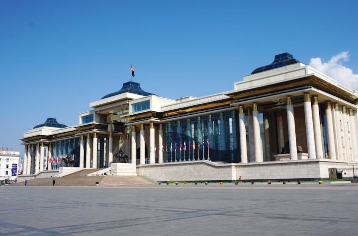 white-concrete-building-under-blue-sky-1